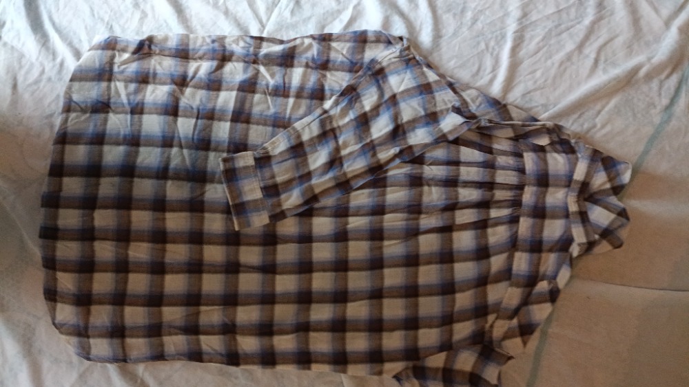 The plaid shirt buttoned up by Sandro