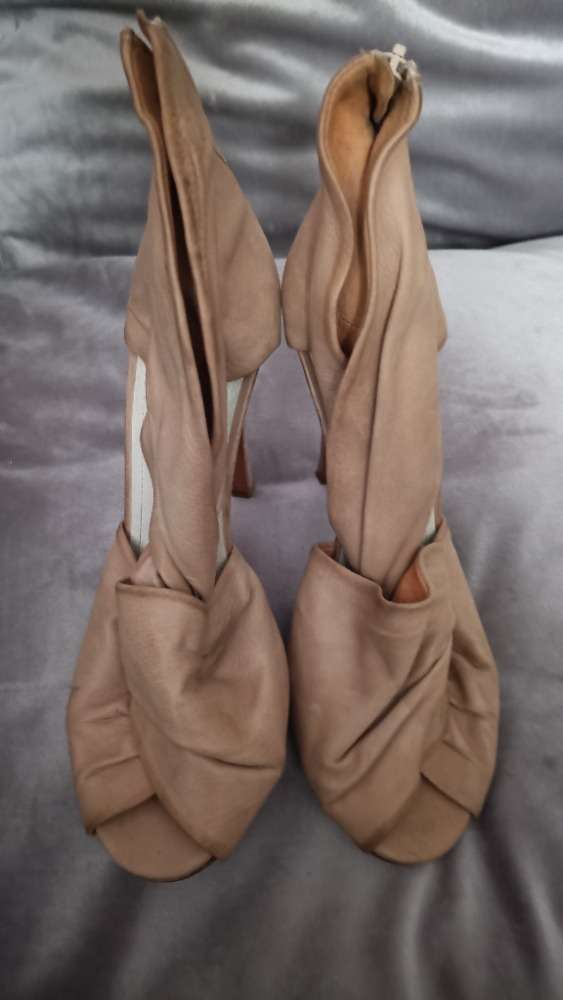 Blushed pink heels with knot details by Maison Margiela