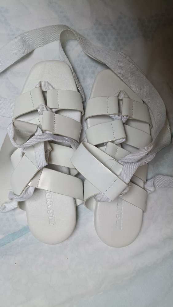 White strappy flat sandals by Jill Sander