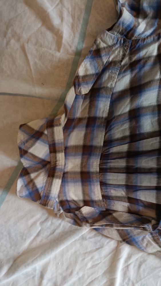 The plaid shirt buttoned up by Sandro