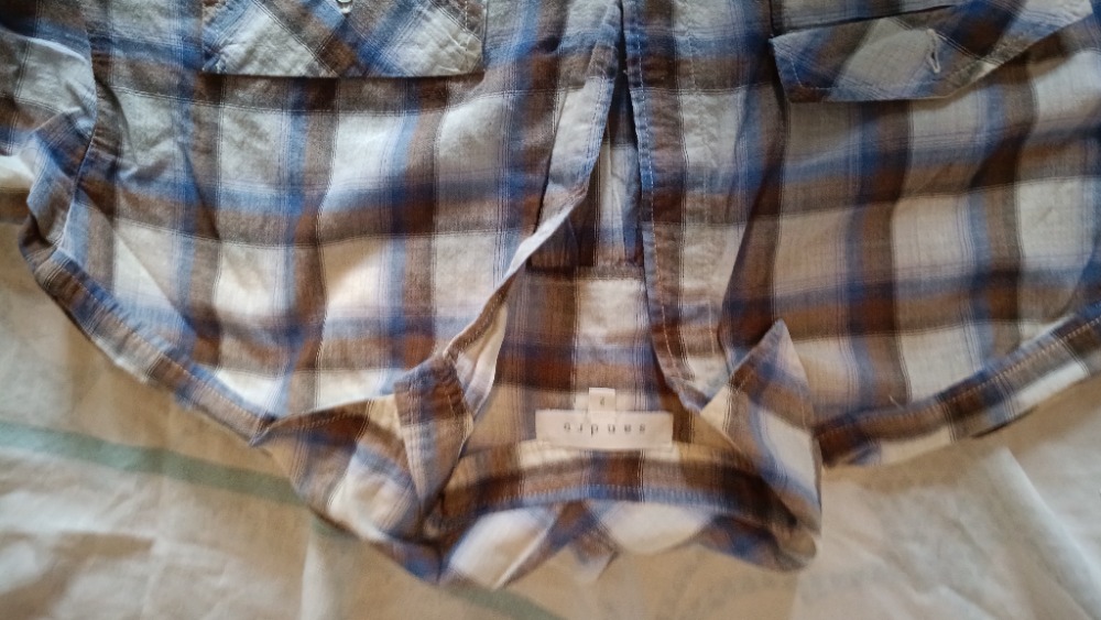 The plaid shirt buttoned up by Sandro