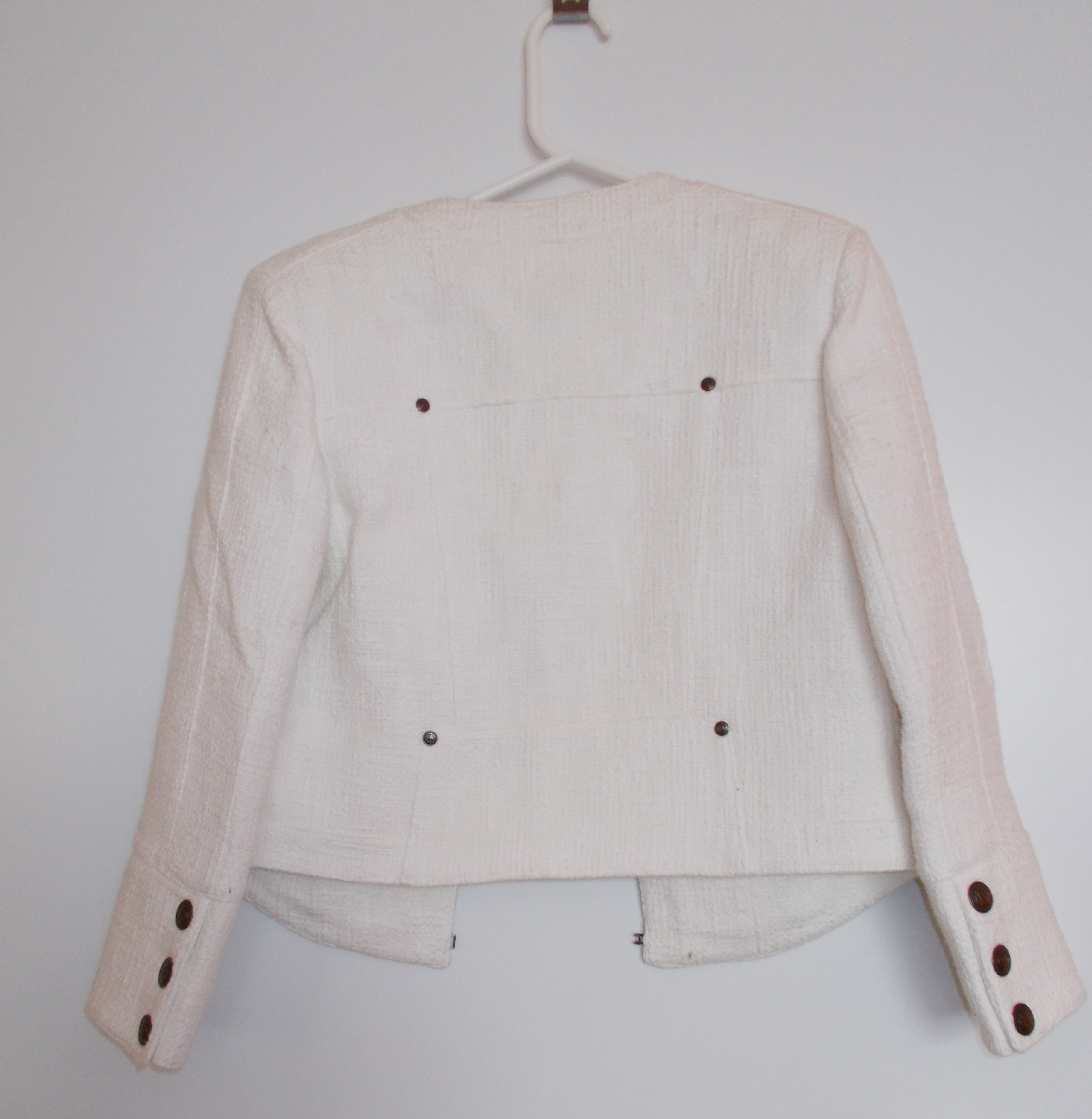 White boucle cropped jacket by Pierre Bailman
