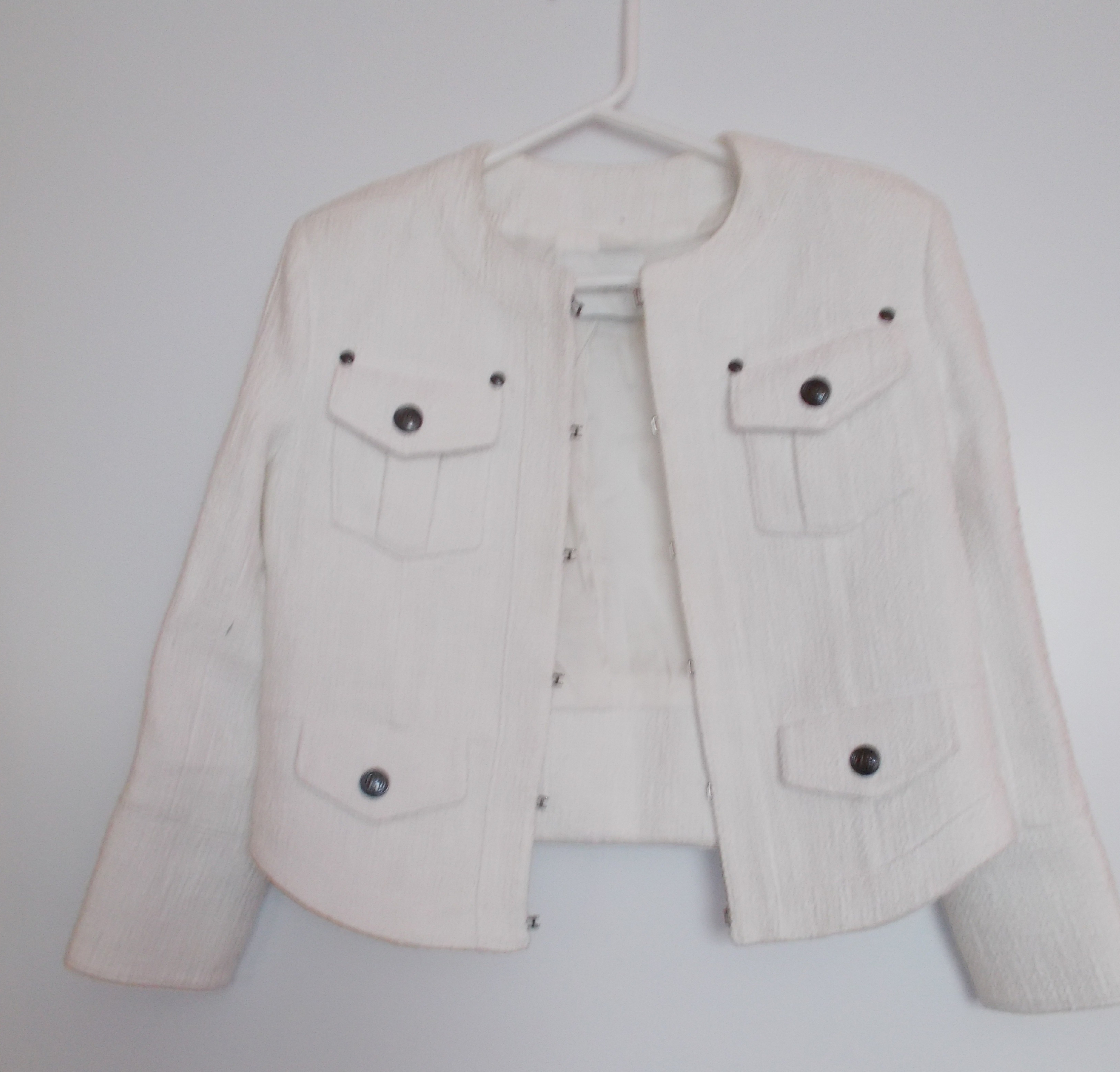 White boucle cropped jacket by Pierre Bailman