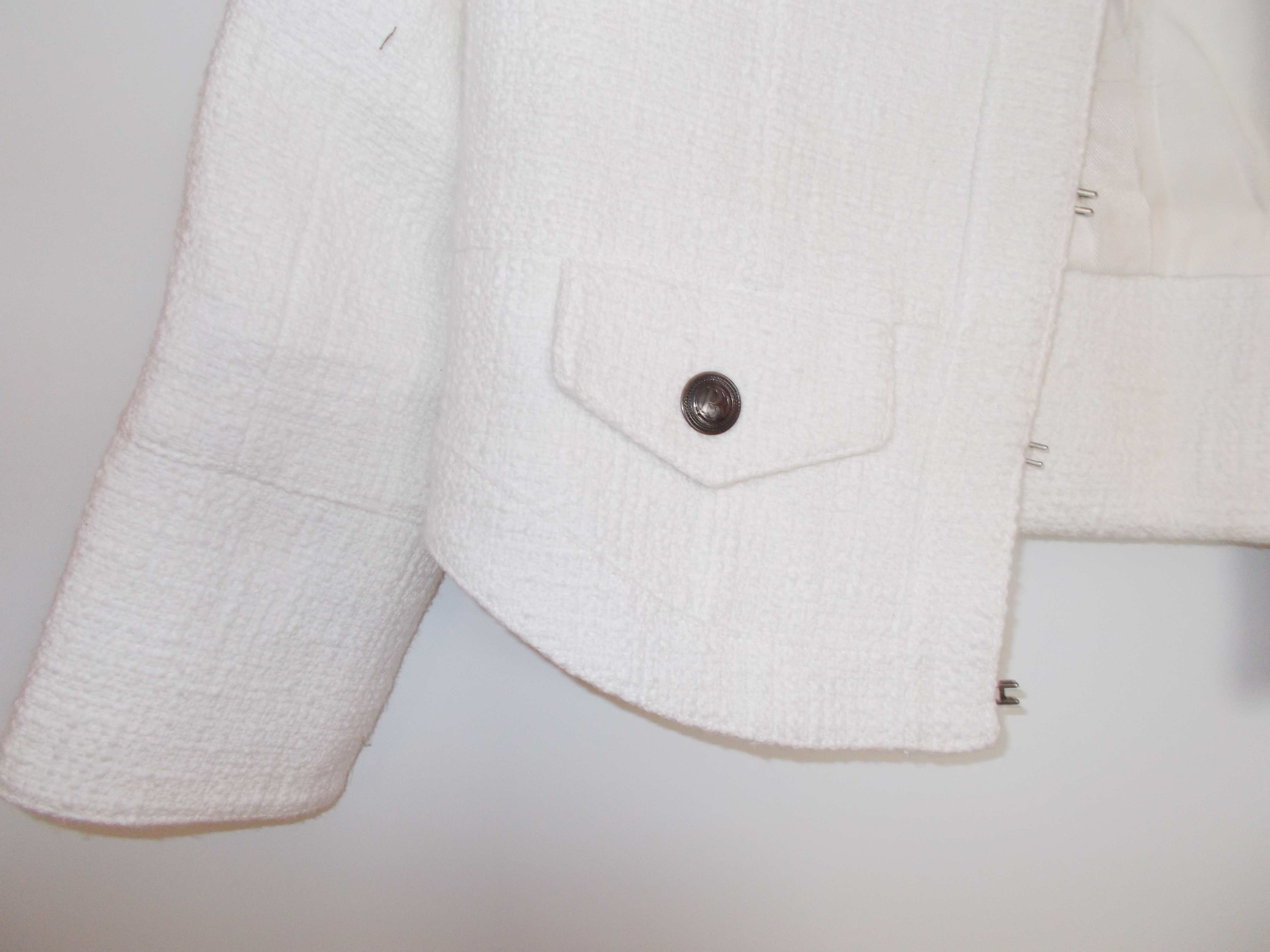 White boucle cropped jacket by Pierre Bailman