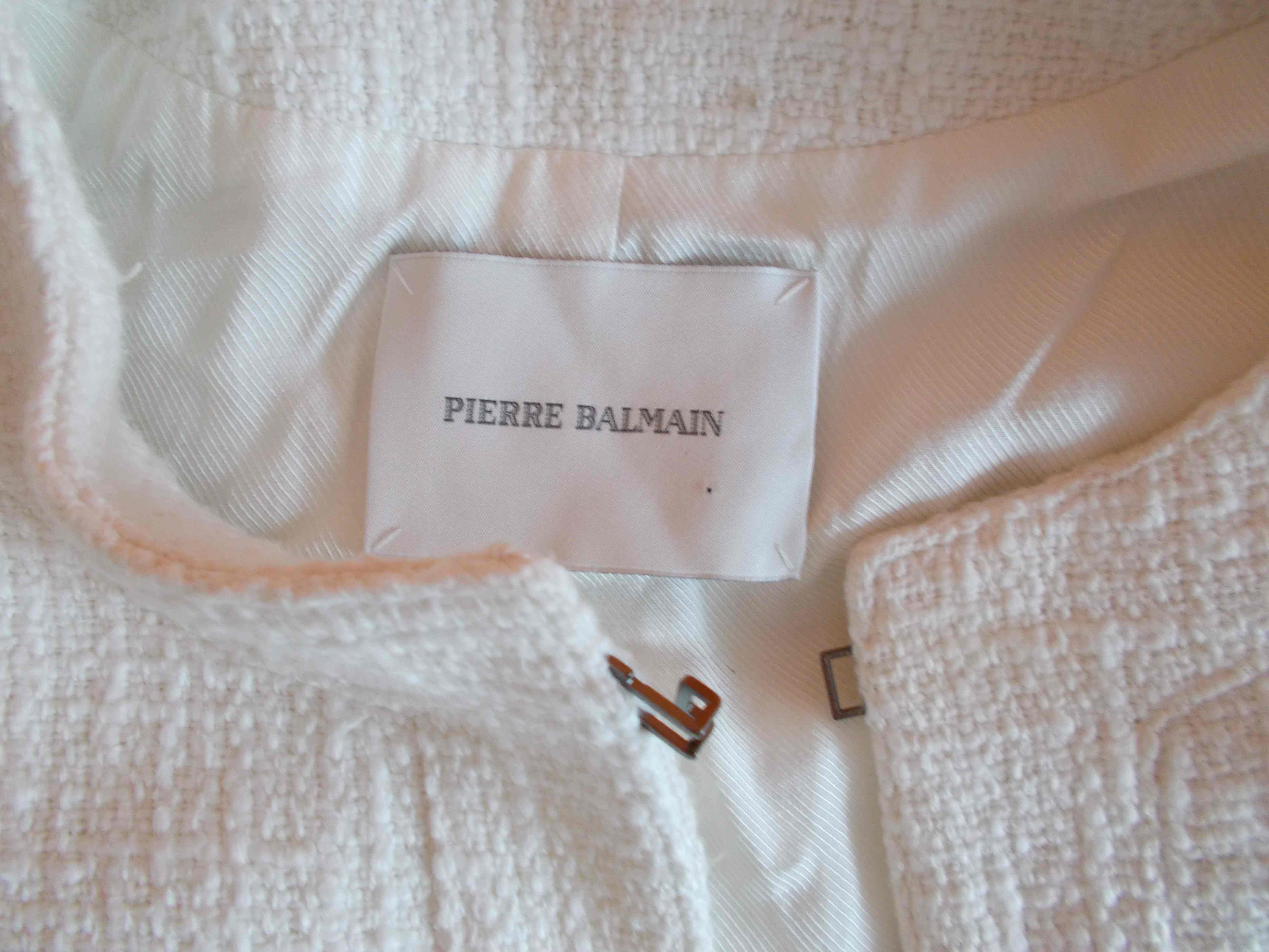 White boucle cropped jacket by Pierre Bailman