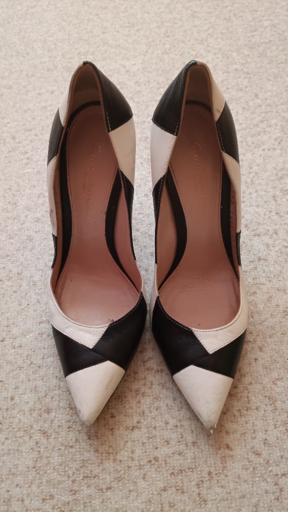 Black and white pointed toe stiletto heel pumps by Gianvito Rossi
