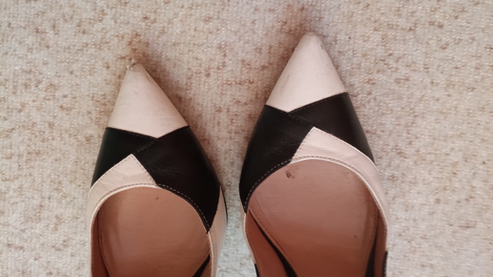 Black and white pointed toe stiletto heel pumps by Gianvito Rossi
