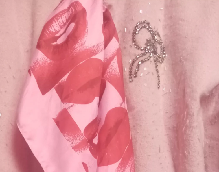 Pink scarf turned into necktie and pink cashmere cardigan trend