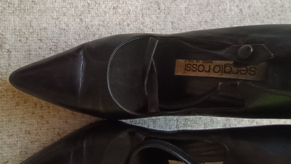 Black high heel pumps with cross strap details